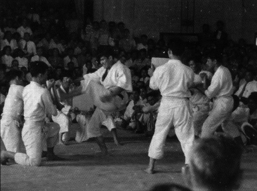 Mr. Ohshima breaking boards using four different methods during the first karate demonstration witnessed by the general public at Nisei Week in Little Tokyo, 1957